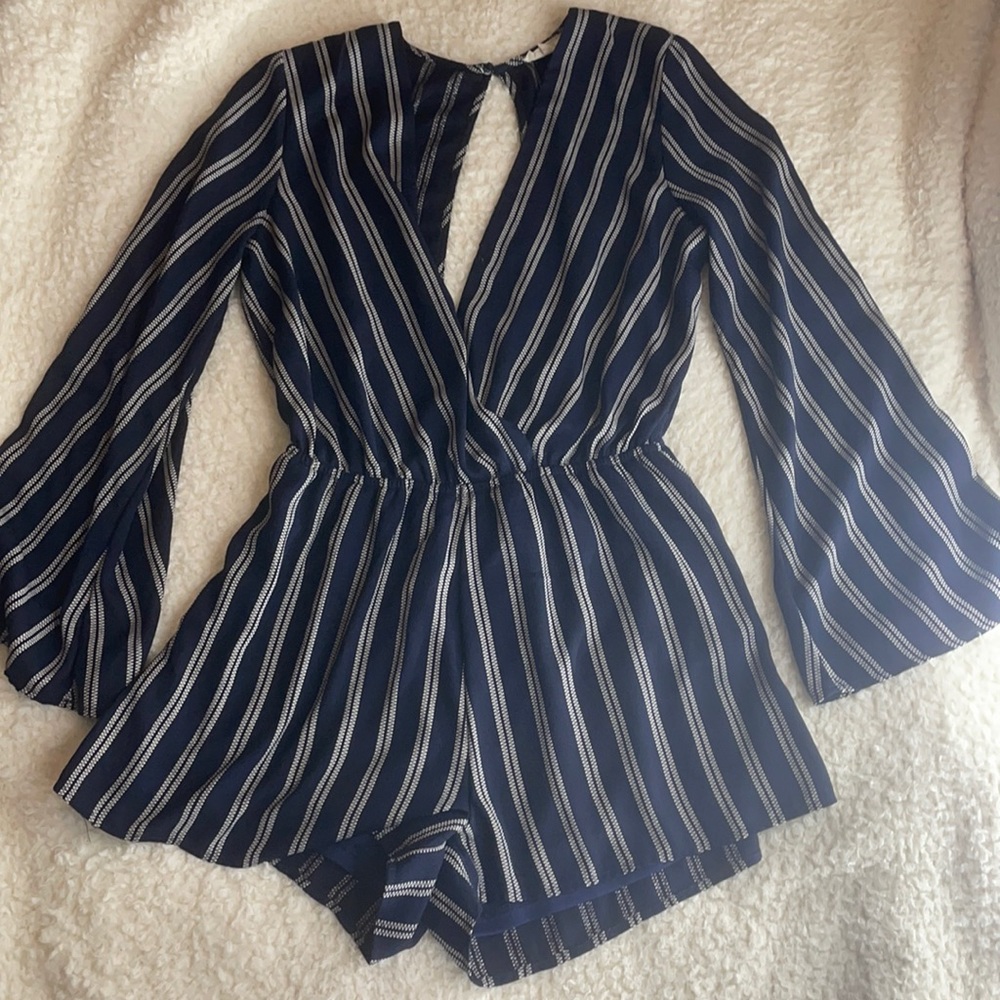 LONG SLEEVE NAVY BLUE ROMPER WITH CREAM ACCENTS AND AN OPEN BACK